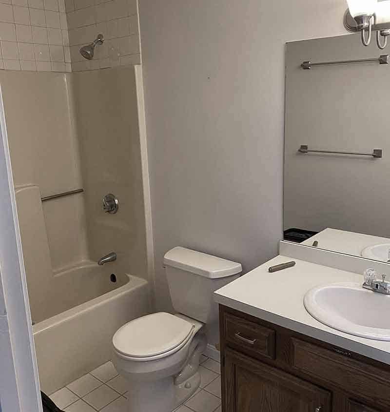 Drab bathroom with tub